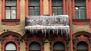 Icicles hang from a balcony of a flat in St.Petersburg February 17, 2004. A recent thaw followed by a sharp drop in temperatures to -10 degrees Celcius on Tuesday has produced similar iceforms across Russia's second city. REUTERS/Alexander Demianchuk REUTERS WAW - RTRCO3F